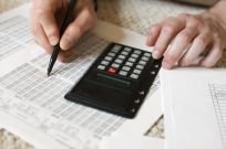 A staff member doing some calculations as part of our tax consulting in Docklands